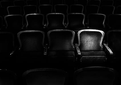 grayscale photography of theater gang chair thumbnail