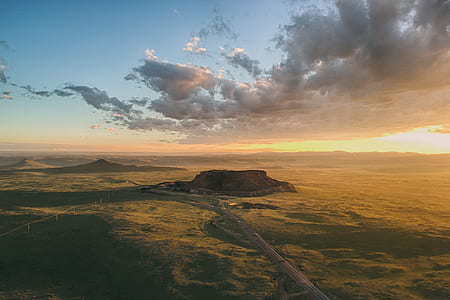 bird's eye view photo of mountain canyon and clouds thumbnail
