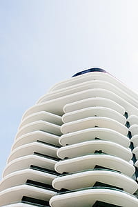 low-angle photography of white concrete building at daytime thumbnail