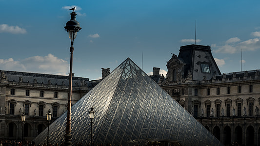 gray triangle building under white and blue sky thumbnail