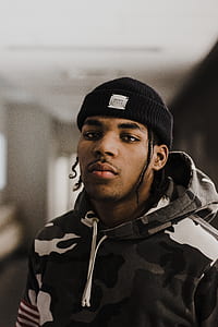 man wearing camouflage hoodie thumbnail