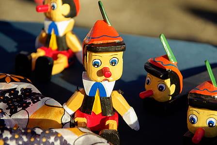 four Pinocchio figurines thumbnail