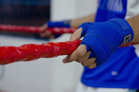 person clinging on red ropes thumbnail