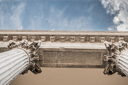 worm's eye view photography of concrete pillars thumbnail