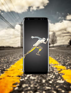 black Samsung Galaxy S8 on road thumbnail