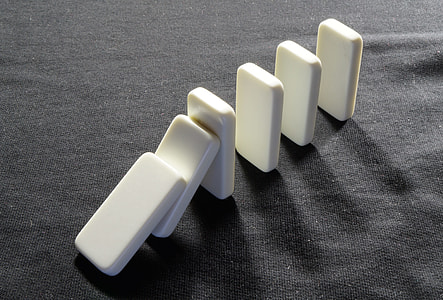 six white erasers on gray cloth thumbnail
