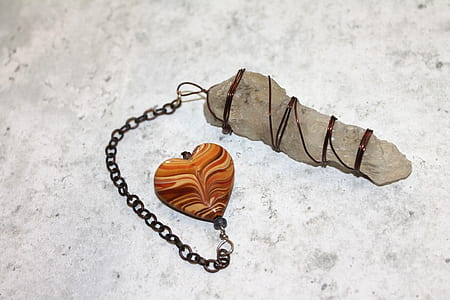 photo of brown and gray stones on sand thumbnail