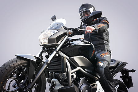 man riding motorcycle photo thumbnail