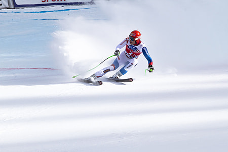 photo of man skiing on snow field during daytime thumbnail