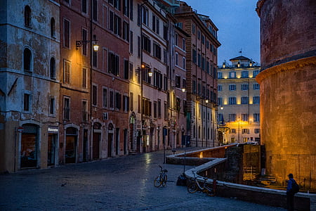 person walking beside building thumbnail