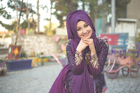 woman wearing purple hijab with purple abaya photo thumbnail