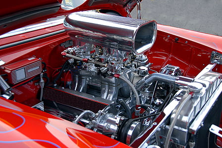 opened gray and black vehicle engine during daytime thumbnail