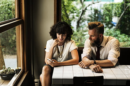 couple sitting beside the table during daytime thumbnail