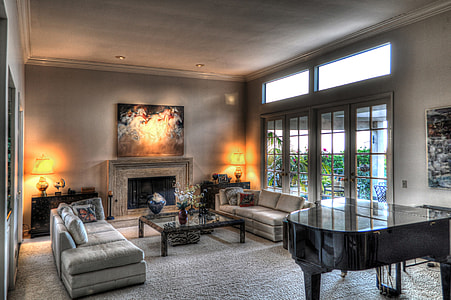 black grand piano in front of silver couch set thumbnail