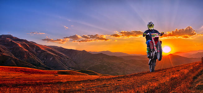 man riding motocross dirt bike thumbnail