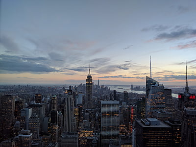 wide angle photo of buildings under cloudy sky thumbnail