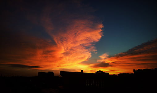 silhouette of building at sunset thumbnail
