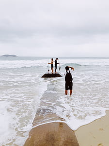 Three Person on Seashore thumbnail