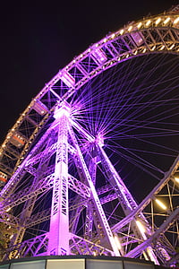 purple and white ferris wheel at nighttime thumbnail