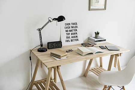 white book on top of wooden table thumbnail
