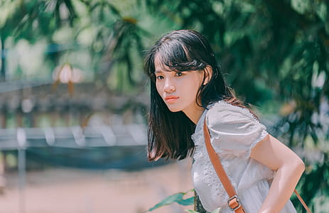 Woman in White Blouse Near Tree thumbnail