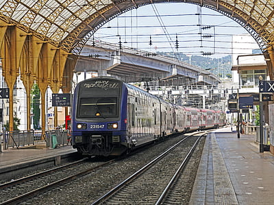blue train on train station during daytime thumbnail