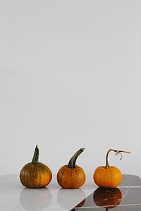 Orange halloween pumpkins on marble thumbnail