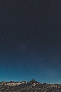 brown rocky mountain during night time thumbnail
