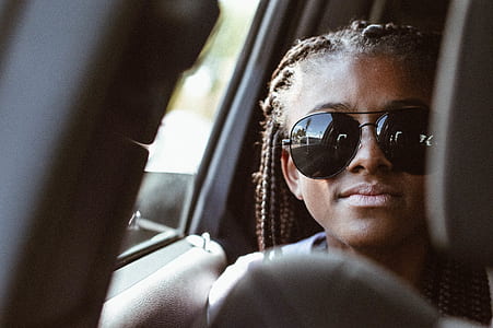 photography of braided hair woman wearing black aviator sunglasses with silver-colored frames thumbnail