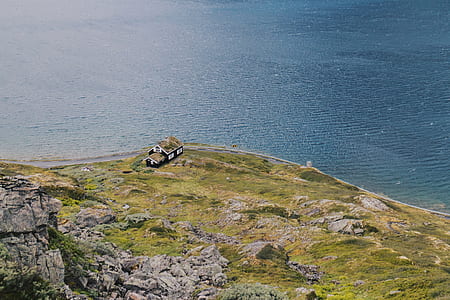 aerial view of gray house near cliff thumbnail