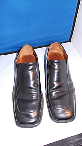pair of black leather dress shoes on white surface thumbnail