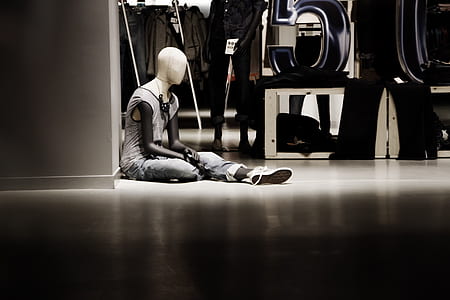 mannequin sitting near wall thumbnail