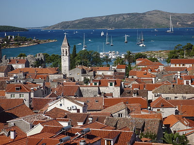 birds-eye photography of houses and cathedral thumbnail