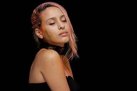 woman wearing black choker with black background thumbnail
