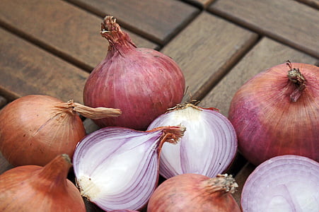 sliced onions on brown wooden surface thumbnail
