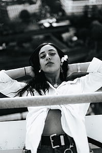 grayscale photo of woman two hands on head thumbnail
