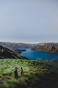 woman and man walking in front of river\ thumbnail