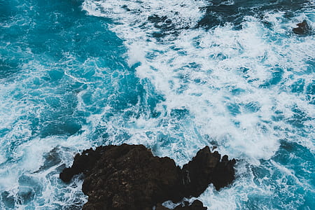 ocean waves during daytime thumbnail