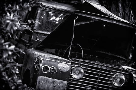 grayscale photography of abandoned vehicle thumbnail