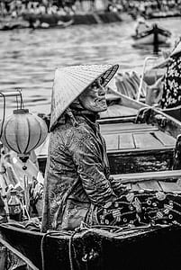 person on boat wearing cap thumbnail