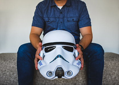 man holding Star Wars Stromtrooper helmet thumbnail