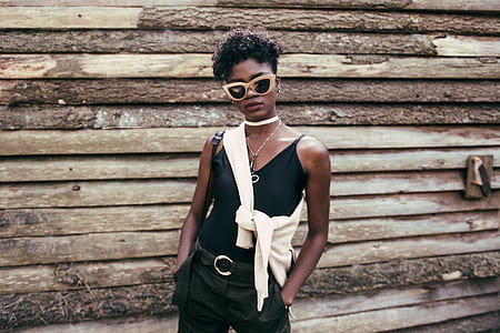 woman beside wooden wall thumbnail