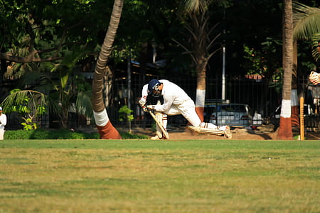 man playing cricket on field during daytime thumbnail