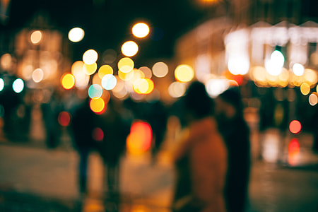 people on street with lights blurry photo thumbnail