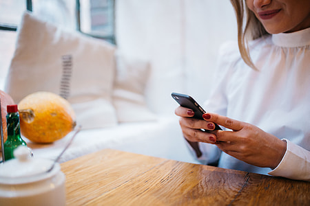 Pretty blonde woman sitting in the cafe thumbnail