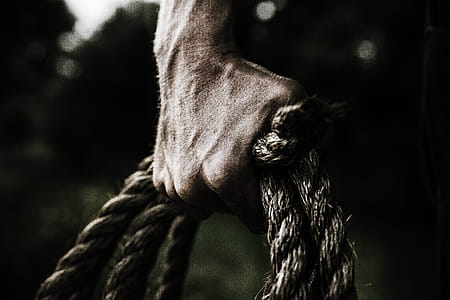 Man Holding Brown Rope thumbnail