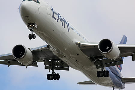 selective focus photography of white LAN plane thumbnail