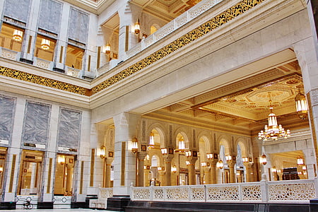 turned-on chandeliers inside hall thumbnail