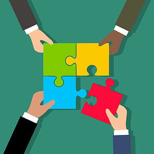 Illustration of putting a team together. Building a business team is like assembling a jigsaw puzzle. thumbnail