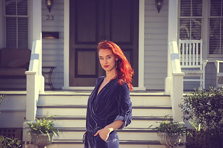 Woman Wearing Black Jumpsuit Standing Near the House thumbnail